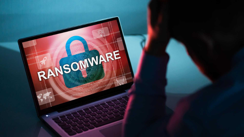 Person looking at computer with ransomware on it